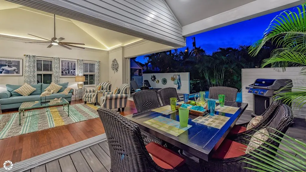 Warmly lit covered lanai at night