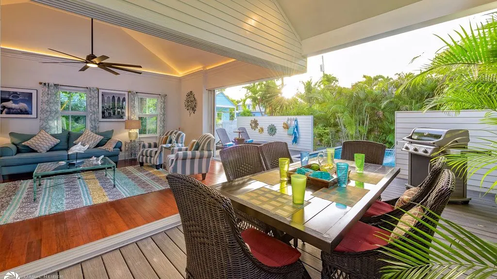 Covered lanai with dining and lounge seating